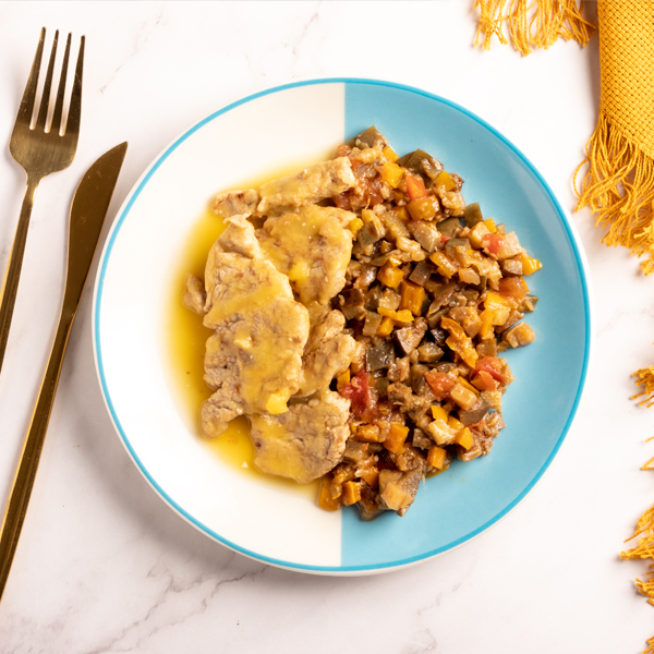 Mignon suino ao molho de laranja com caponata